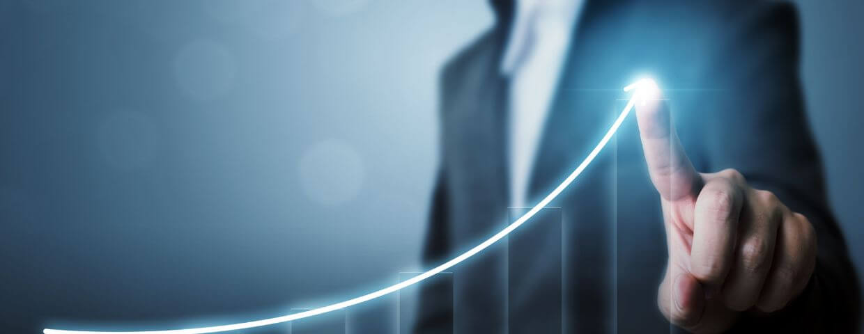 businessman touching screen, graph moving up, growth concept