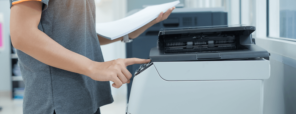 Man using printer machine.